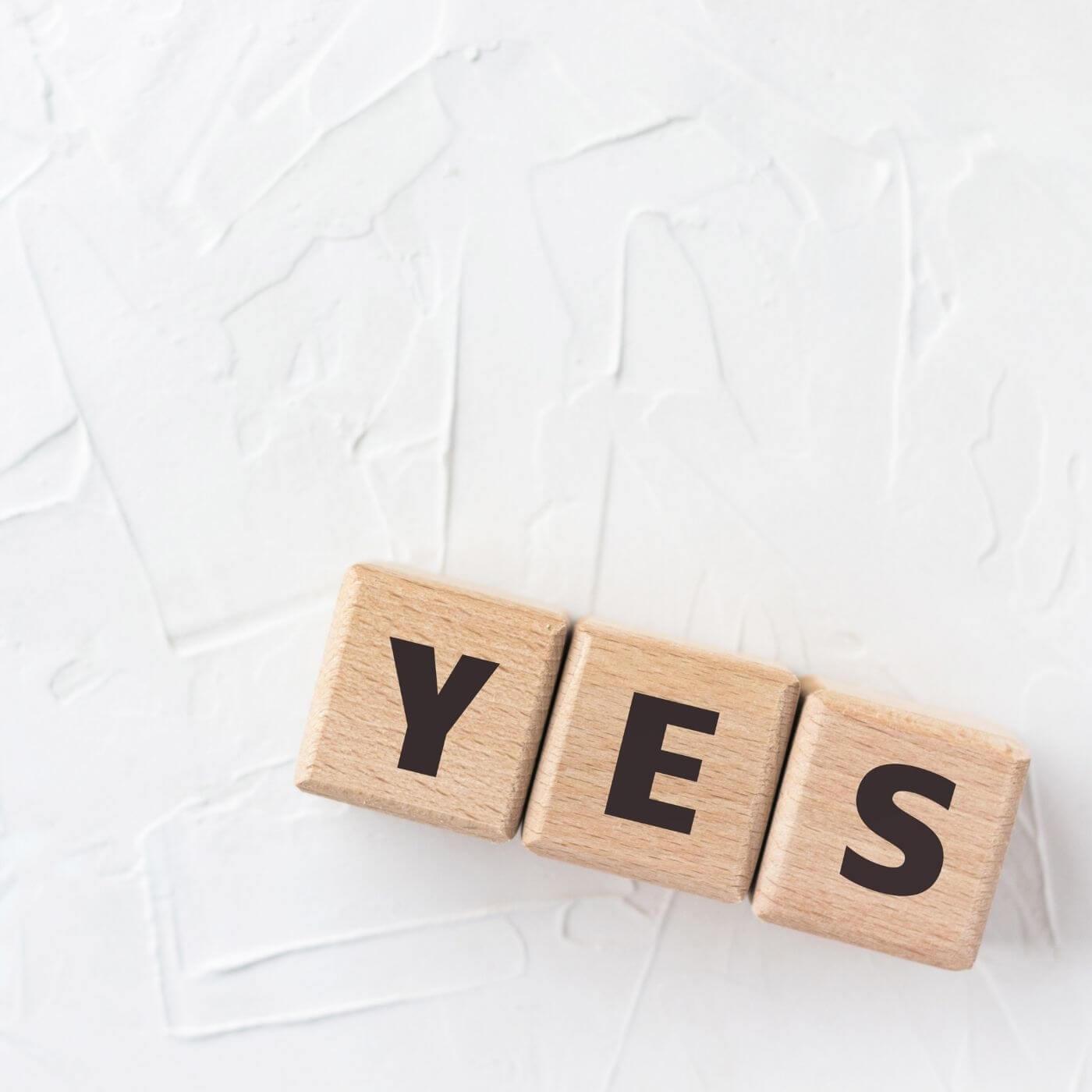 Wooden blocks spelling yes