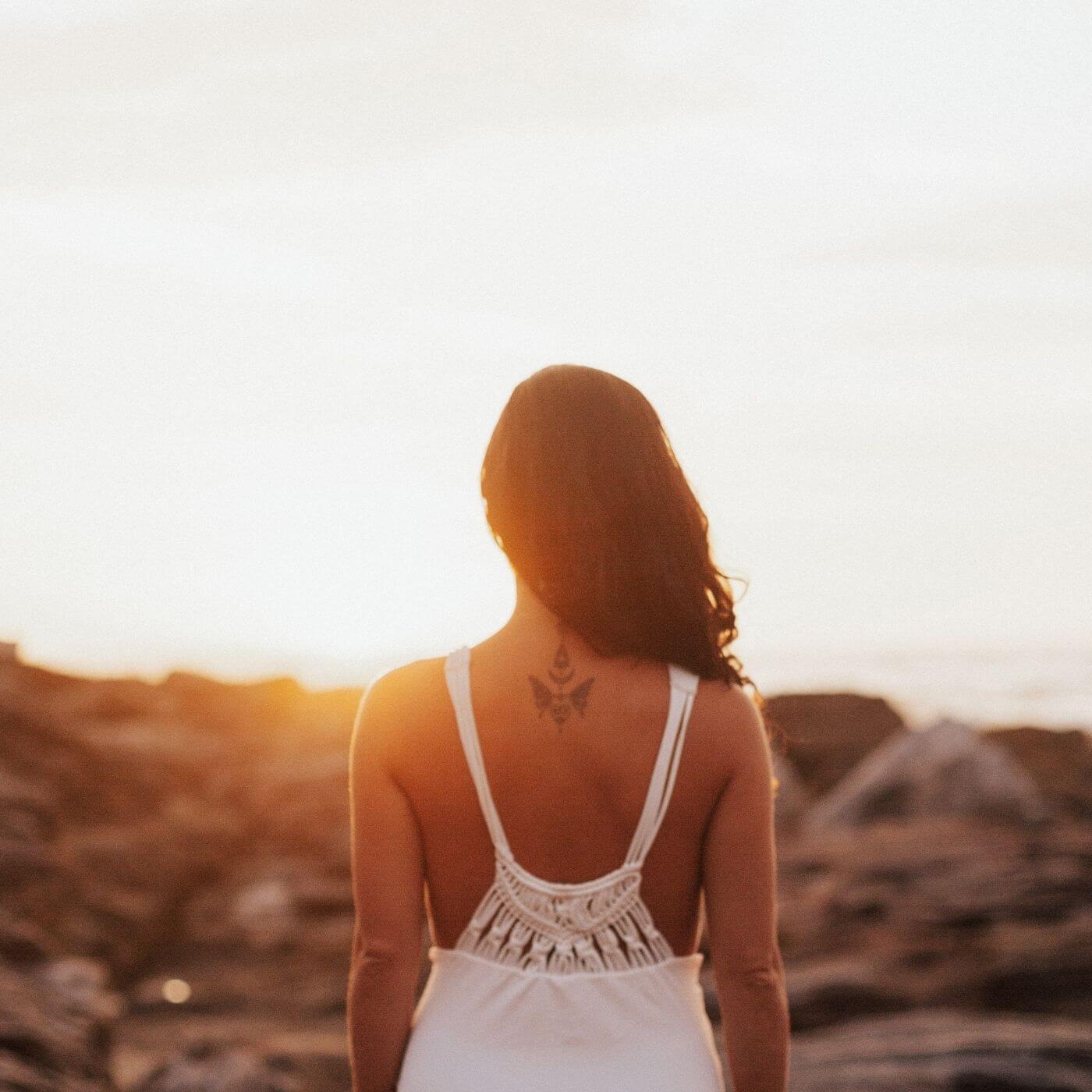 Woman looking at sunset