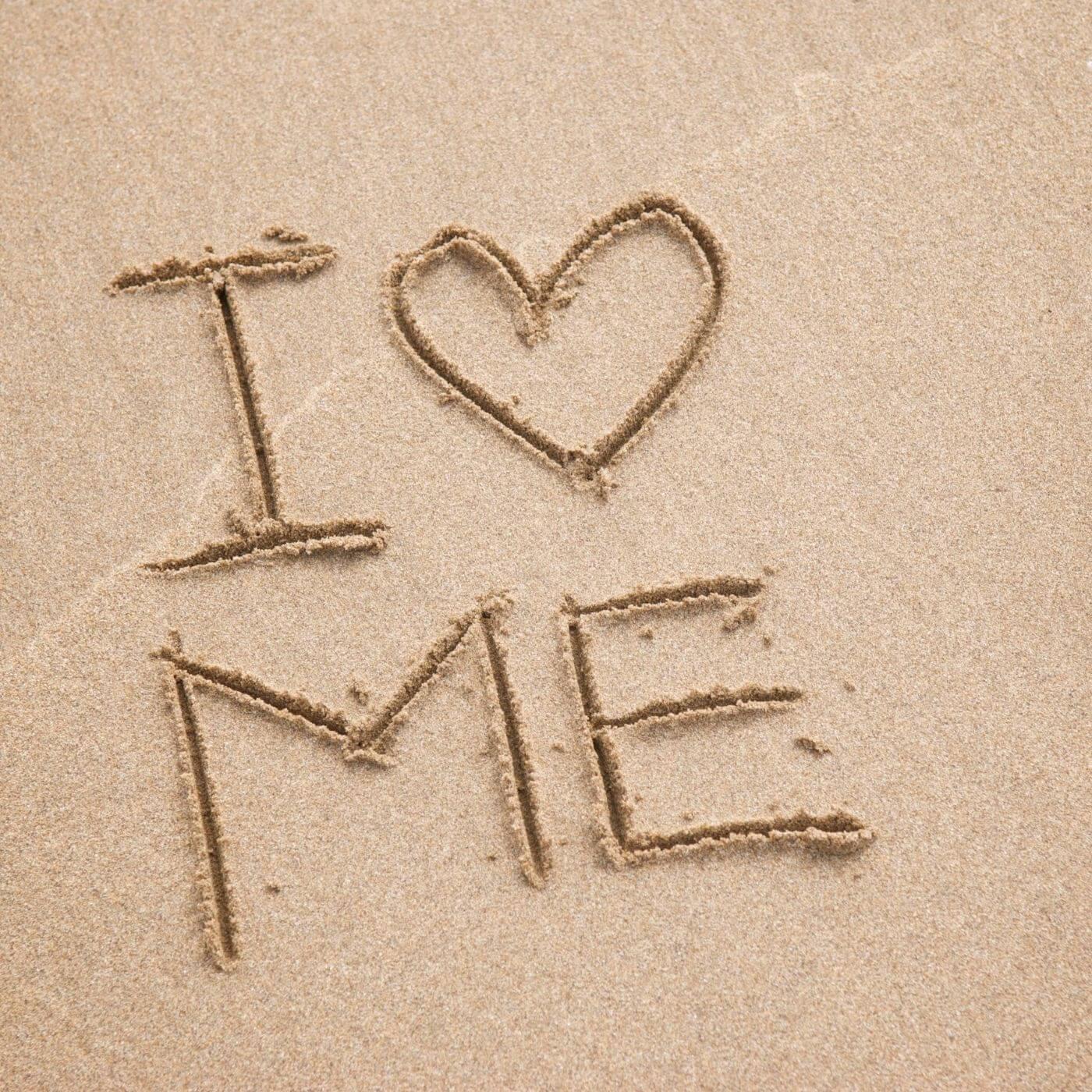 I heart me written in the sand